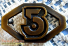 Army of Light buckle.png