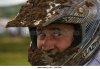 man-with-crash-helmet-covered-with-mud-involved-in-motocross-racing-b443nc.jpg