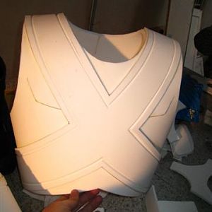 The glued X on chest