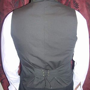 corseted back, in black cotton.