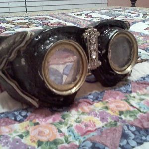 goggles made of purse parts, swimming goggles, cans, and two liter plastic for the lenses