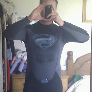 The symbol and belt buckle made from a hot glue gun on a full length wetsuit