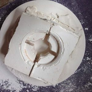 The 3 piece plaster of paris mold. I originally planned to put a core in the middle to create a cavity where the metal was not needed, but it "floated