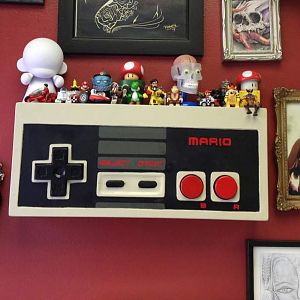 NES shelf i made all out of 1/2 plywood its 10.5' h &24' w ..i made it to have at the shop i work at as a shelf for the figures ppl give me