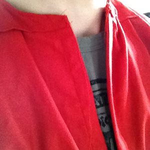 The neck of the red shirt after the front and back have been sewn.