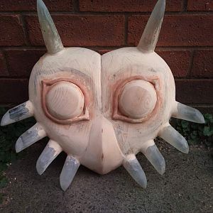 Here I have moulded the horns from resin and used clay to make the ential pattern shape around the eyes.