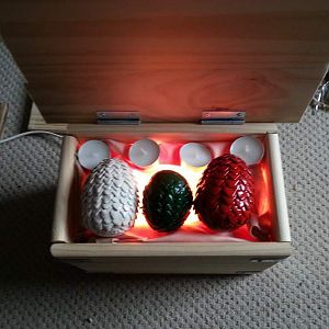 Game of Thrones Dragon Egg Chest
Polystyrene eggs covered in clay scales and sprayed, 
Chest made from a shelf, hinges and L shape brackets