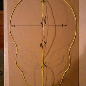 Beginning stage wire on cardboard with measurements.