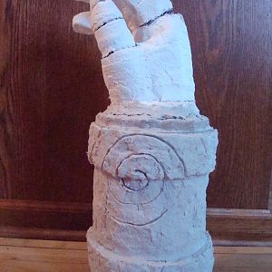 Hand of Doom, started with a hockey glove and large cardboard tube, covered with paper mache.