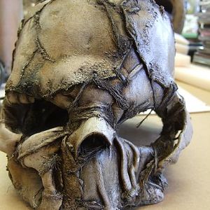 skull mask. Heat formed EVA, formed leather, cast uretane bone-elements, hemp twine, acrylic paints