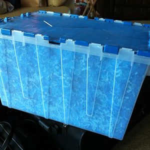 Correct tub lined with white poster board which is covered in shredded blue tissue paper.
I needed an easy-to-carry prop for walking the convention f