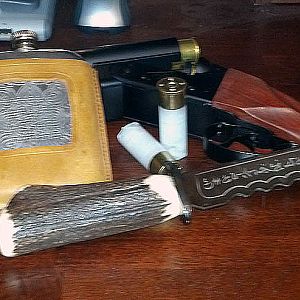 Tools of the Trade!  Sawed off shotgun with rock salt rounds, Demon Killing Knife of the Kurds, and Whiskey!