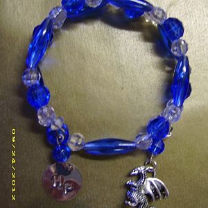 ravenclaw bracelet (with dragon charm because she liked dragons)