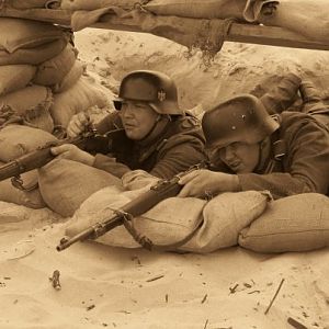 Rifle pit on the beach, D-Day 2008. 
Didn't have as much time to prepare our position on the beach as we did back at camp sadly. Notice our boots up