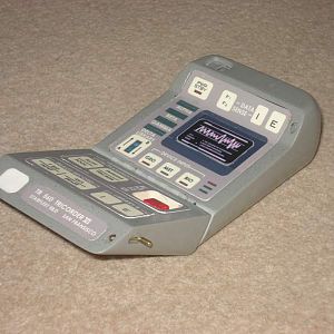 This is an early Star Trek:TNG Tricorder that featured in the 1st, 2nd and early 3rd seasons. This model is a non functioning prop although it does ha