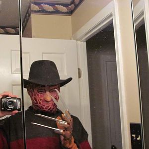 my Freddy Krueger costume complete with homemade glove and mask.