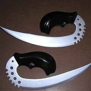 handle added to riddick knives for accuracy, all metal.