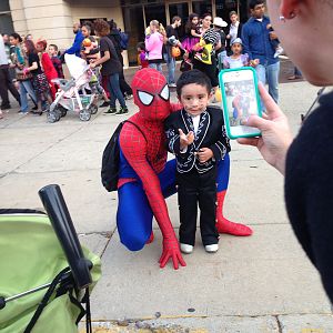 Taking a picture with a little fan at an event downtown.