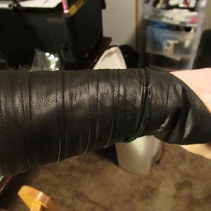 Arm band, made from leather.