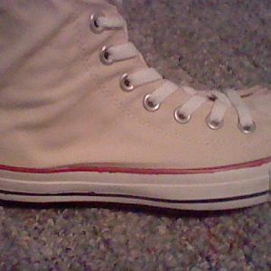 Close up side view of converse boots.  I tea dye the shoes and painted the black stripes red and blue.