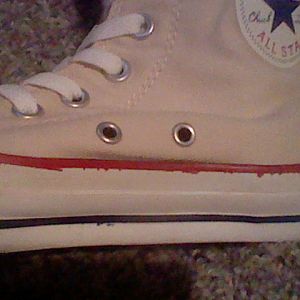 Close up of other side of converse boots. I tea dye the shoes and painted the black stripes red and blue.