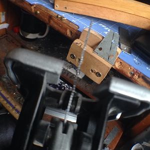 From some 'Simpson tie down' I cut hinges.
