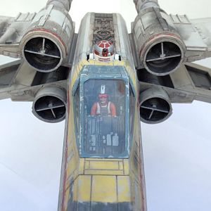 The cockpit with a little Wedge Antilles sitting inside.