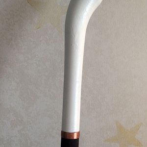 I commissioned a 3D artist to create the cane handle, and then used the company Shapeways to print it.  Here is the handle attached to the cane, with