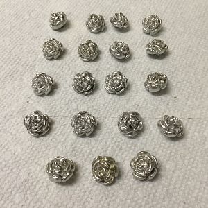 A plethora of Wonka vest buttons cast in pewter.