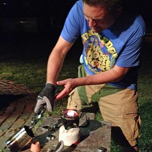 Here I am casting the vest buttons in pewter one fine evening.