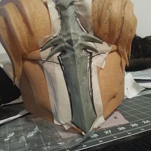 sculpting the front sword on the breastplate
