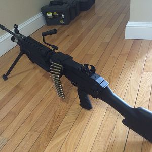 This is actually a 10/22.  I put it inside of a M249 SAW body and attached a fake belt to make it look awesome (it turns heads at any range you go to!