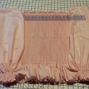The dress bodice and sleeve wrists ready to be smocked (embroidered).