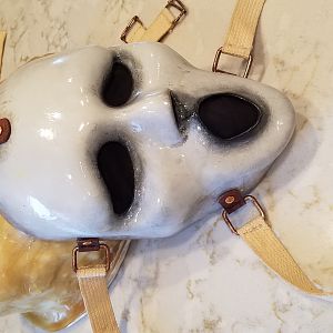 Glossed and strapped finished mask