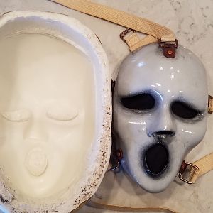 Finished mask next to mold