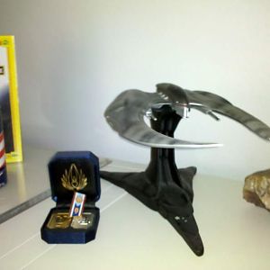 A couple of BSG pieces.  Some replica cubits from a user on this forum and Qmx"s Cylon Raider polystone sculpt.