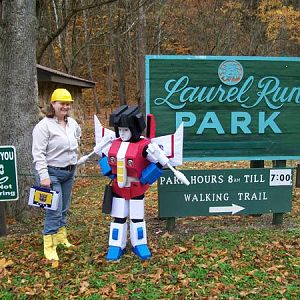 Little Starscream Halloween '09 (still unfinished at that point) with me as a G1 human carrying Soundwave in tape deck form at a party in the park.