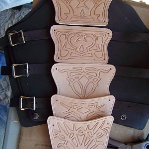 this was work in progress pics. all of the designs are cut and tooled to actualy stand out. it was probb about 6-7 oz leather. on oiled tanned /chrome